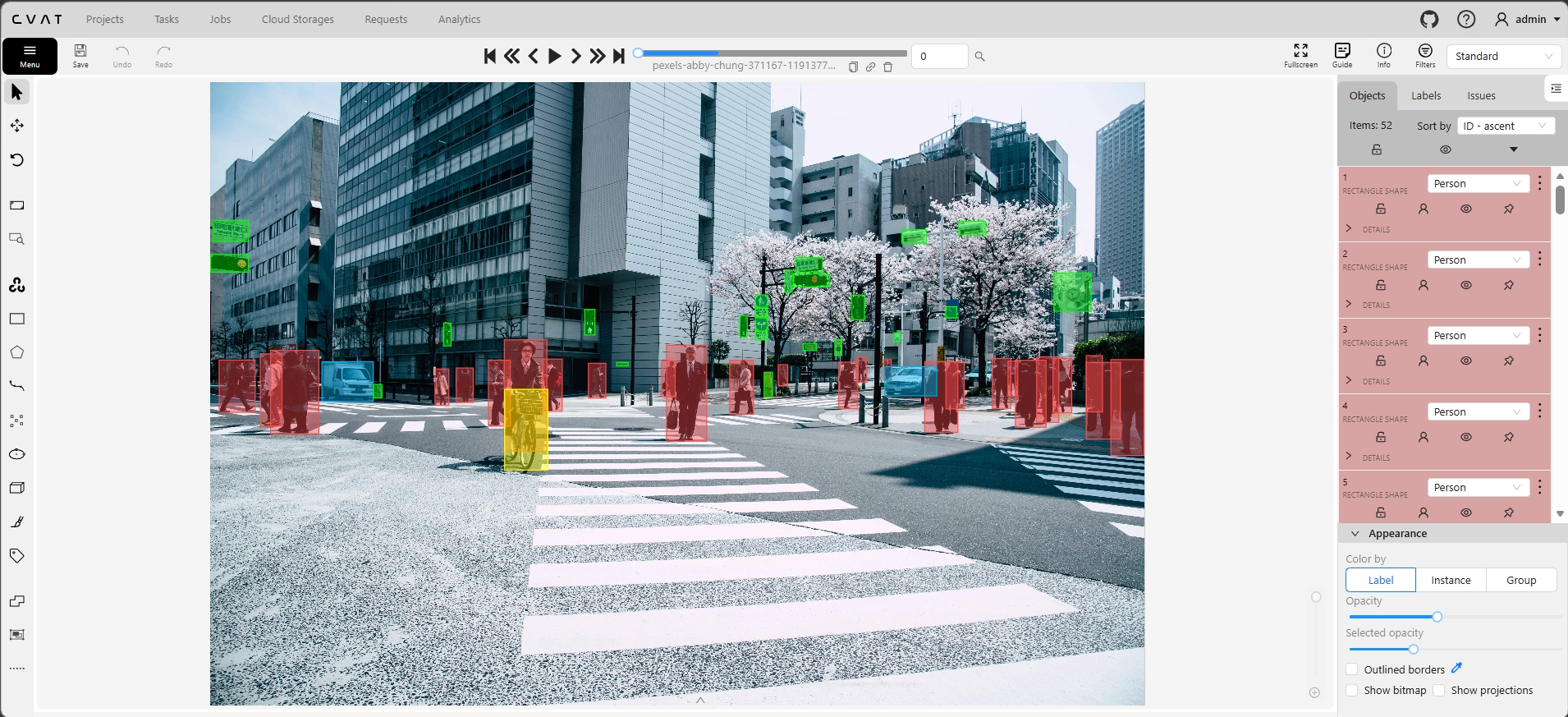 CVAT bounding box annotation - 52 person objects in crowded urban crosswalk scene
